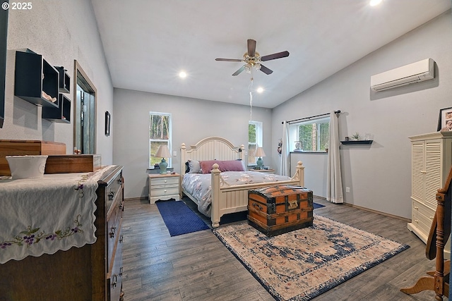 bedroom with recessed lighting, a wall mounted air conditioner, vaulted ceiling, wood finished floors, and a ceiling fan