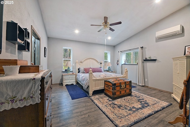 bedroom with ceiling fan, lofted ceiling, dark wood-type flooring, and a wall mounted AC