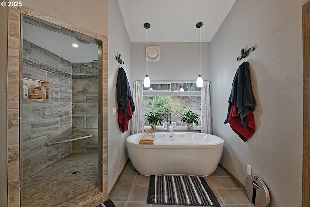 bathroom featuring tile patterned flooring, a baseboard radiator, and plus walk in shower