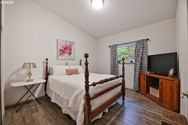 bedroom featuring dark wood-type flooring and lofted ceiling