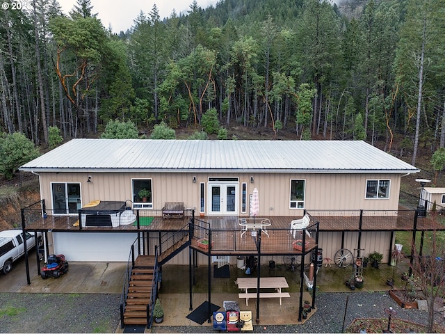 back of house featuring a deck