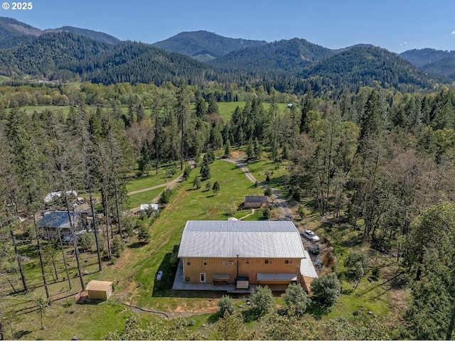 bird's eye view featuring a view of trees and a mountain view
