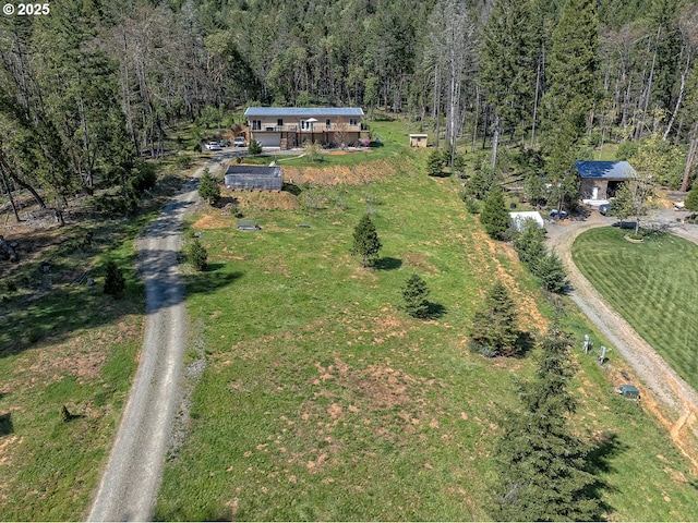 bird's eye view featuring a view of trees