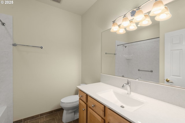 bathroom with a shower, tile patterned floors, toilet, and vanity