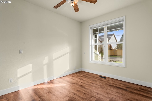 empty room featuring ceiling fan and wood-type flooring