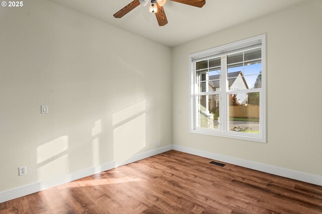 unfurnished room featuring ceiling fan and hardwood / wood-style floors