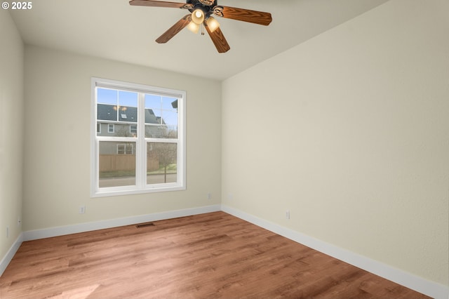 empty room with light hardwood / wood-style flooring and ceiling fan