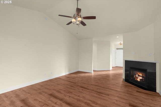 unfurnished living room featuring lofted ceiling, hardwood / wood-style floors, and ceiling fan