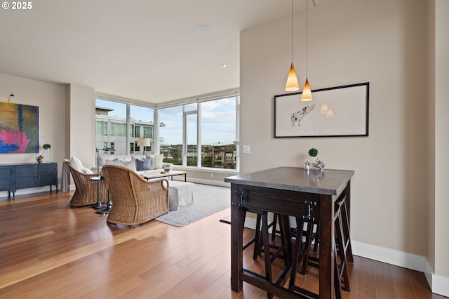 1930 S River Dr Unit W1003, Portland, OR 97201 - dining area featuring wood finished floors and baseboards
