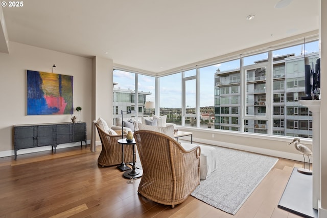 1930 S River Dr Unit W1003, Portland, OR 97201 - living room featuring healthy amount of natural light and hardwood / wood-style floors