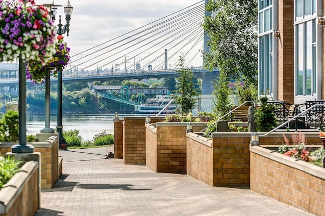 view of community with a water view