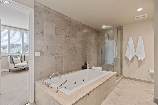 1930 S River Dr Unit W1003, Portland, OR 97201 - full bath with baseboards, a shower stall, a tub with jets, recessed lighting, and tile patterned flooring
