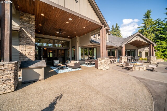 22100 NE 41st Ct, Ridgefield, WA 98642 - view of patio with an outdoor living space with a fire pit and ceiling fan