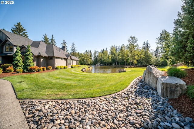 22100 NE 41st Ct, Ridgefield, WA 98642 - view of home's community featuring a water view, a patio area, and a lawn