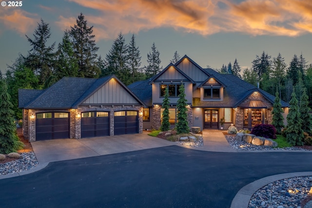 22100 NE 41st Ct, Ridgefield, WA 98642 - craftsman inspired home with board and batten siding, french doors, stone siding, and concrete driveway