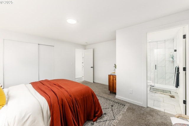 carpeted bedroom with baseboards, a closet, ensuite bathroom, and recessed lighting