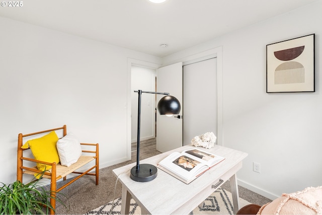 carpeted office featuring baseboards