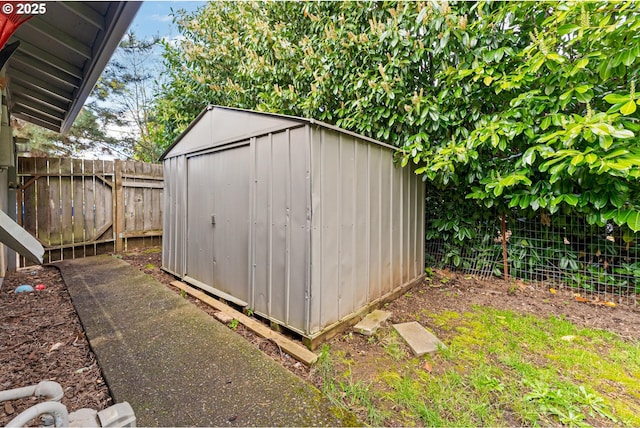 view of shed with a fenced backyard