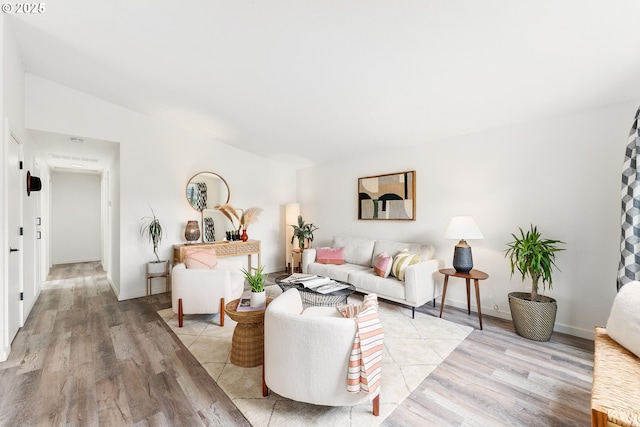 living room featuring light wood-style floors and baseboards