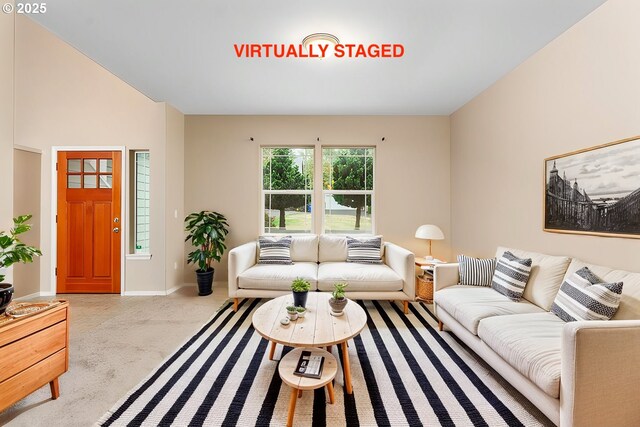 living area with light carpet and baseboards