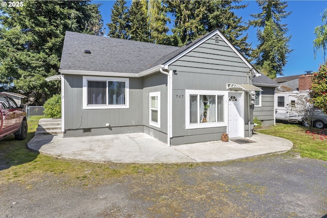 767 32nd Ave, Longview, WA 98632 - view of front of home with a shingled roof and a patio area