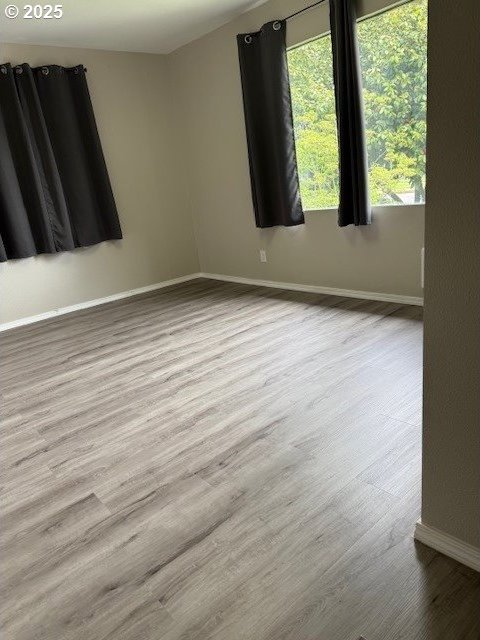 767 32nd Ave, Longview, WA 98632 - unfurnished room featuring baseboards and wood finished floors