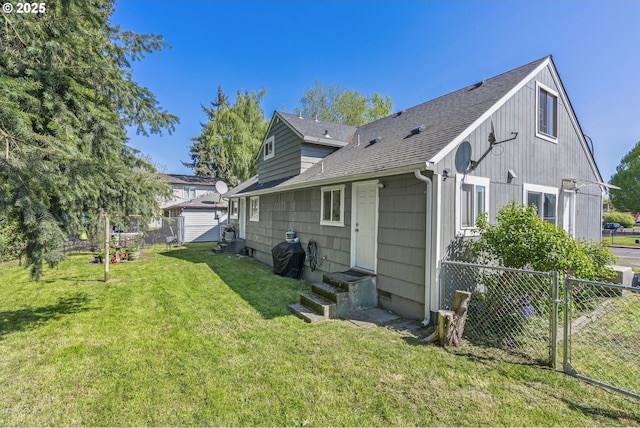 767 32nd Ave, Longview, WA 98632 - rear view of house featuring entry steps and roof with shingles