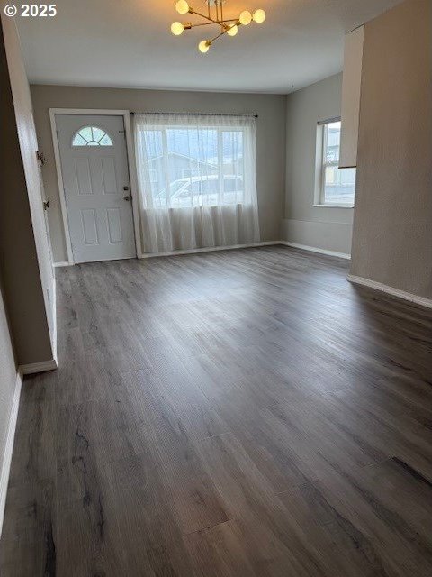 767 32nd Ave, Longview, WA 98632 - entrance foyer with a chandelier, baseboards, and dark wood-type flooring