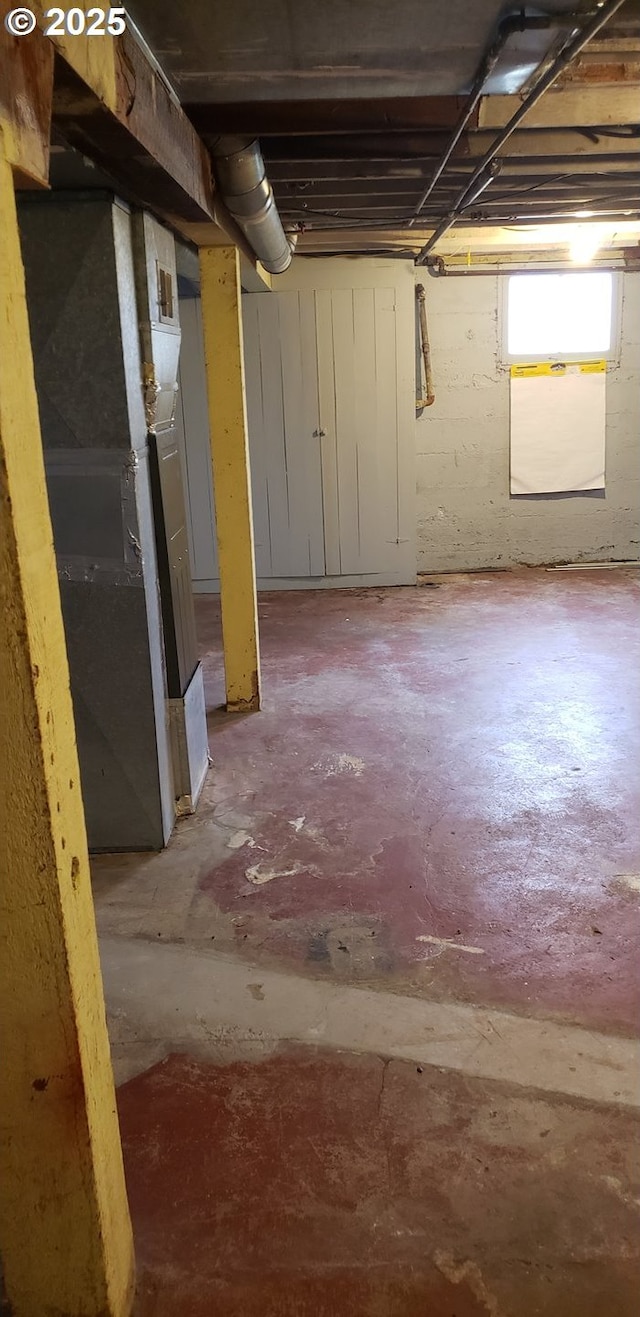 basement featuring heating unit