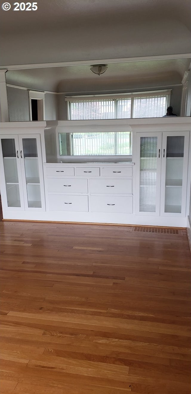 empty room with wood finished floors