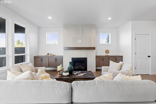 2112 NW 17th Pl, Battle Ground, WA 98604 - living room with plenty of natural light, dark wood finished floors, a tiled fireplace, and recessed lighting