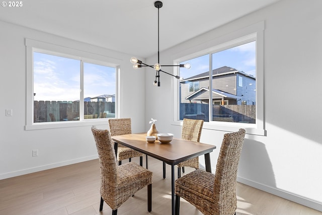 2112 NW 17th Pl, Battle Ground, WA 98604 - dining space with healthy amount of natural light, a chandelier, and light wood finished floors