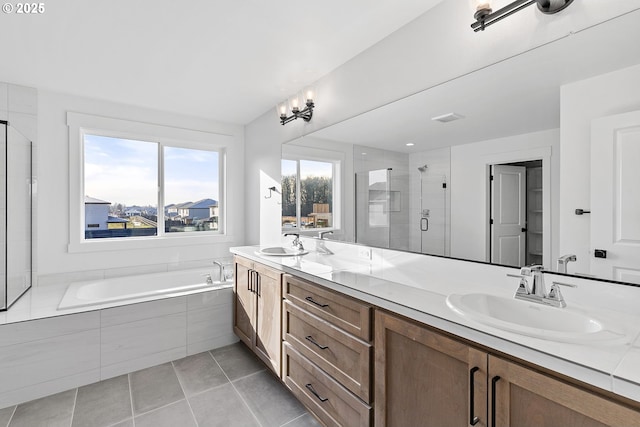 2112 NW 17th Pl, Battle Ground, WA 98604 - full bathroom featuring double vanity, a shower stall, tile patterned floors, and a garden tub