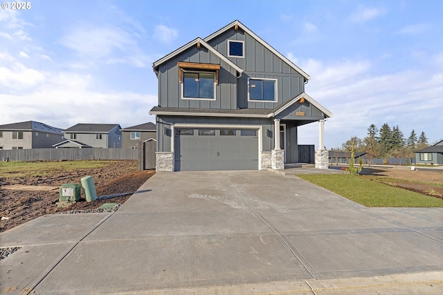 2112 NW 17th Pl, Battle Ground, WA 98604 - craftsman-style home featuring board and batten siding, an attached garage, stone siding, and driveway
