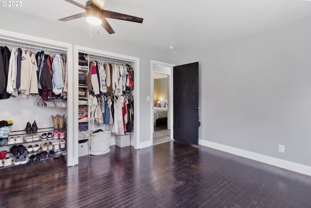 bedroom featuring ceiling fan, baseboards, and wood finished floors