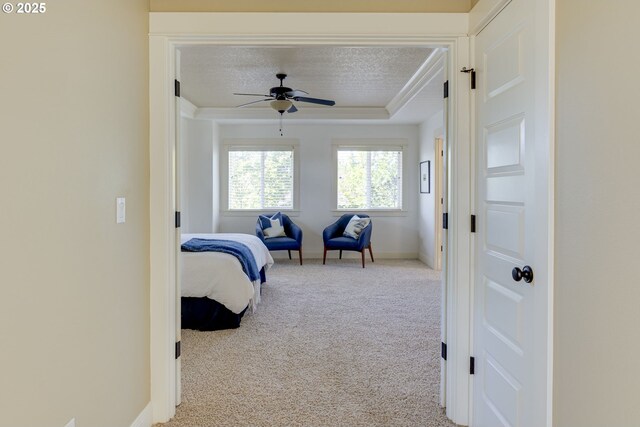 7010 N Kellogg St, Portland, OR 97203 - carpeted bedroom featuring a tray ceiling, baseboards, and a ceiling fan