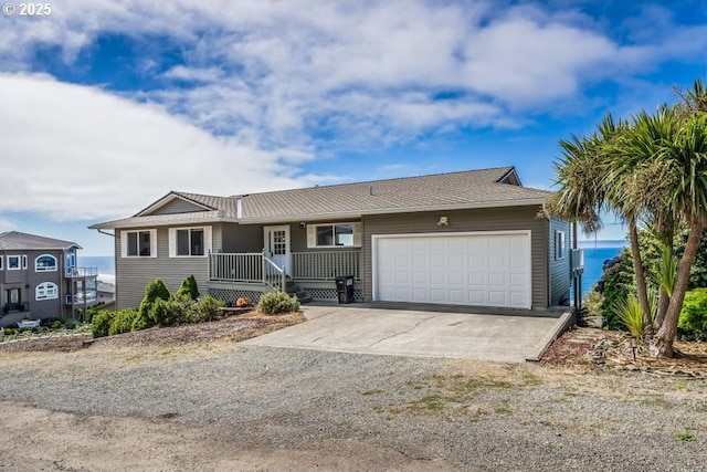 461 Terrace Dr, Rockaway Beach, OR 97136 - single story home with an attached garage, driveway, and covered porch