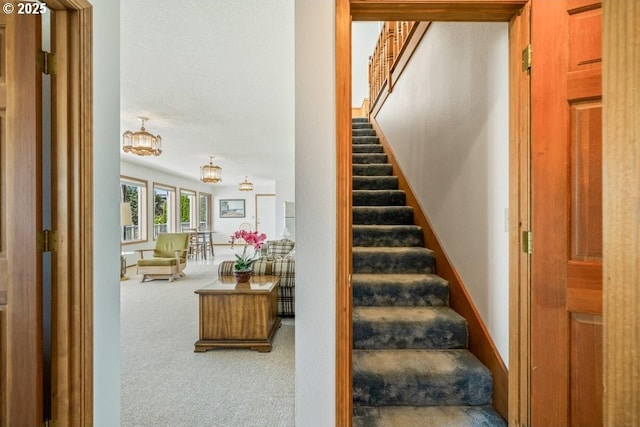 461 Terrace Dr, Rockaway Beach, OR 97136 - stairway with carpet and a chandelier