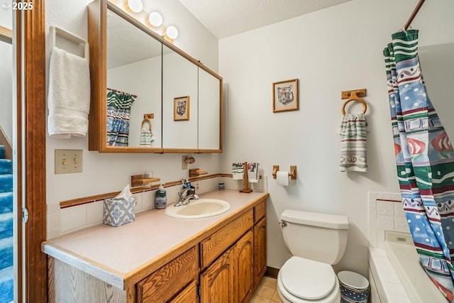 461 Terrace Dr, Rockaway Beach, OR 97136 - full bath featuring toilet, vanity, and tile patterned flooring
