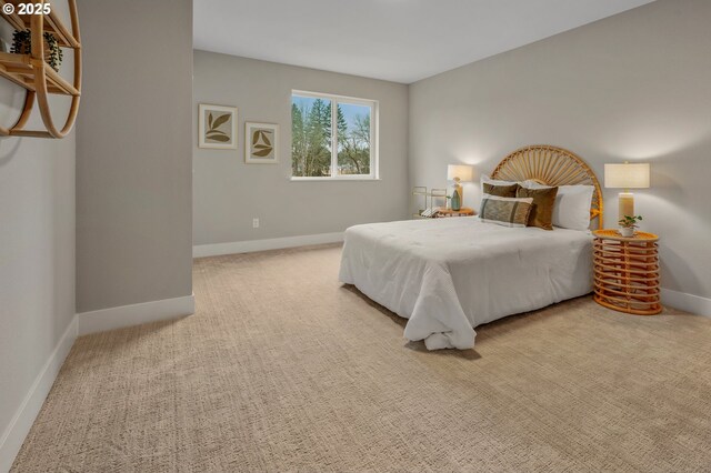 carpeted bedroom featuring baseboards