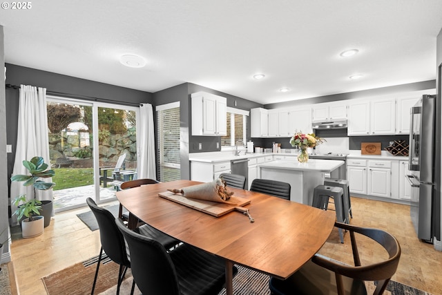 dining space with light hardwood / wood-style floors