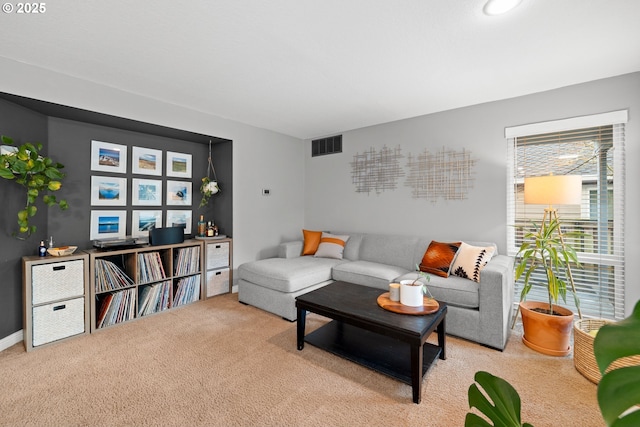 living room featuring light carpet