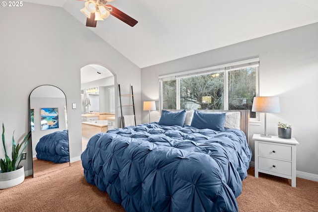 carpeted bedroom featuring ensuite bathroom, high vaulted ceiling, and ceiling fan