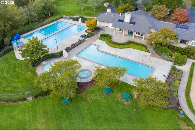 view of pool featuring a yard and a patio