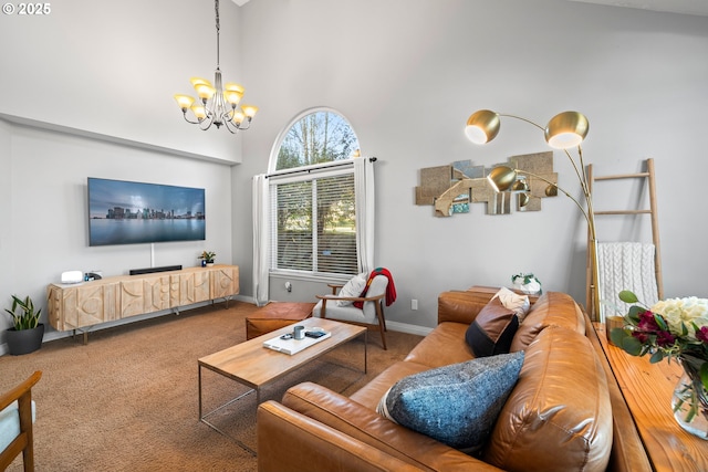 carpeted living room featuring a towering ceiling and a chandelier