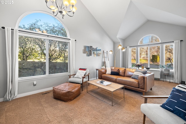 living room featuring an inviting chandelier, carpet floors, and high vaulted ceiling