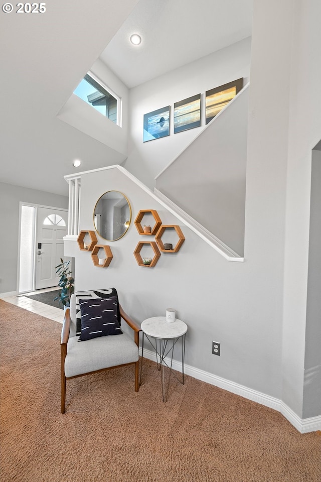 living area with carpet and lofted ceiling