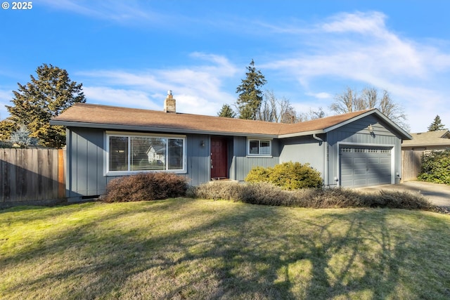 ranch-style house with a garage and a front yard