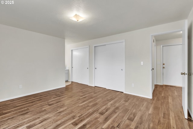 unfurnished bedroom featuring wood-type flooring