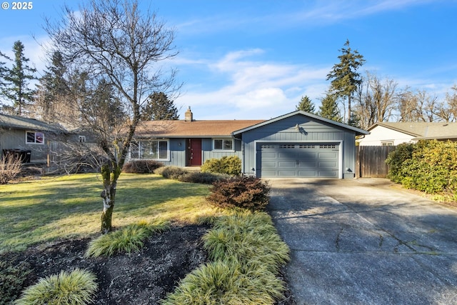 ranch-style home featuring a garage and a front lawn